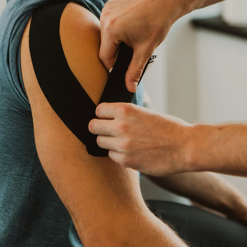 Chiropractor performing injury assessment on patient at Kelowna ICBC claims clinic