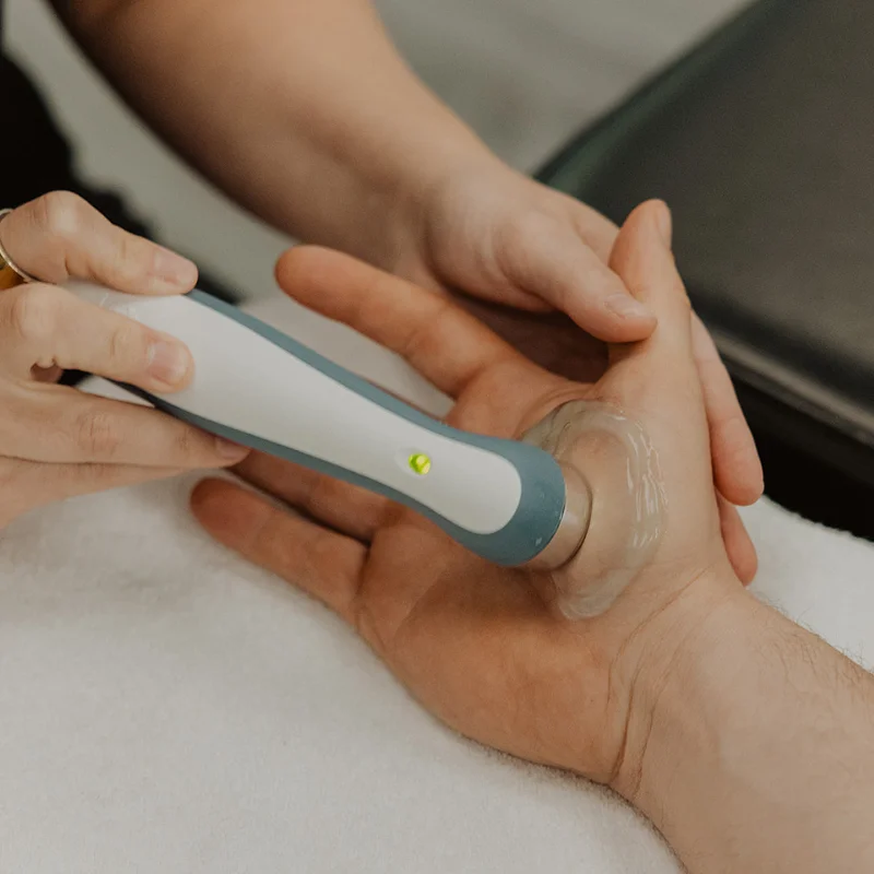 Therapeutic ultrasound applied during chiropractic treatment to reduce pain and support healing in Kelowna