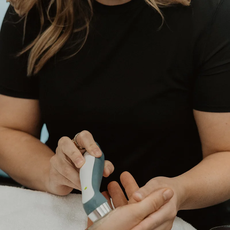 Close-up of therapeutic ultrasound used in chiropractic care to improve circulation and reduce discomfort