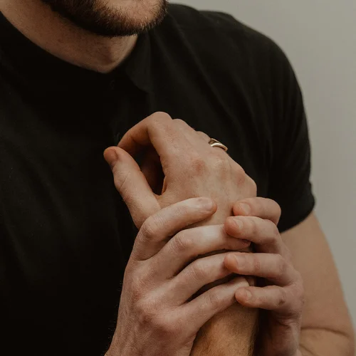 Wrist pain and joint discomfort being treated during registered massage therapy session