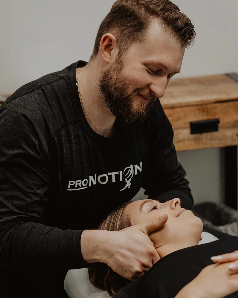 Concussion treatment focusing on neck mobility and symptom relief at Pro Motion Clinic
