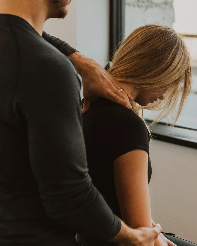 Myofascial release therapy targeting neck and upper back tension at Pro Motion Clinic