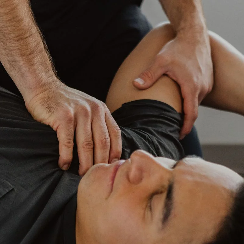Chiropractor performing shoulder and upper body adjustment to relieve pain in Kelowna