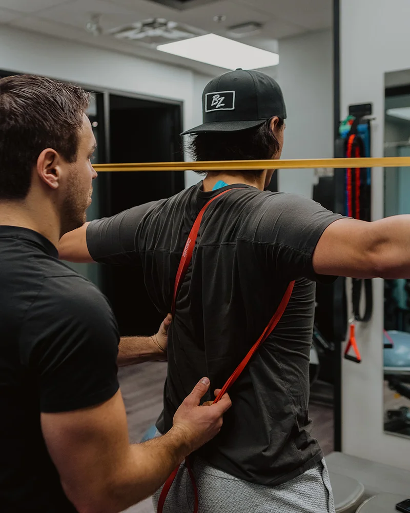 Movement screen focusing on upper back activation and posture using resistance band