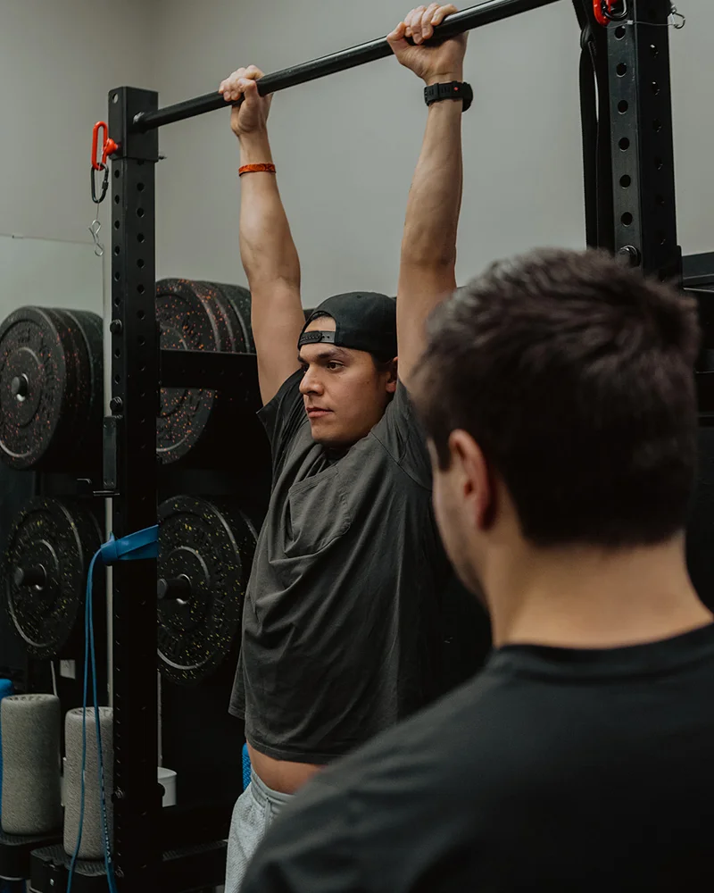 Movement screening test assessing shoulder mobility and control with overhead bar position