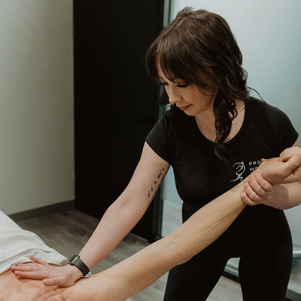 Manual therapy treatment for arm and muscle pain at Pro Motion Clinic in Kelowna