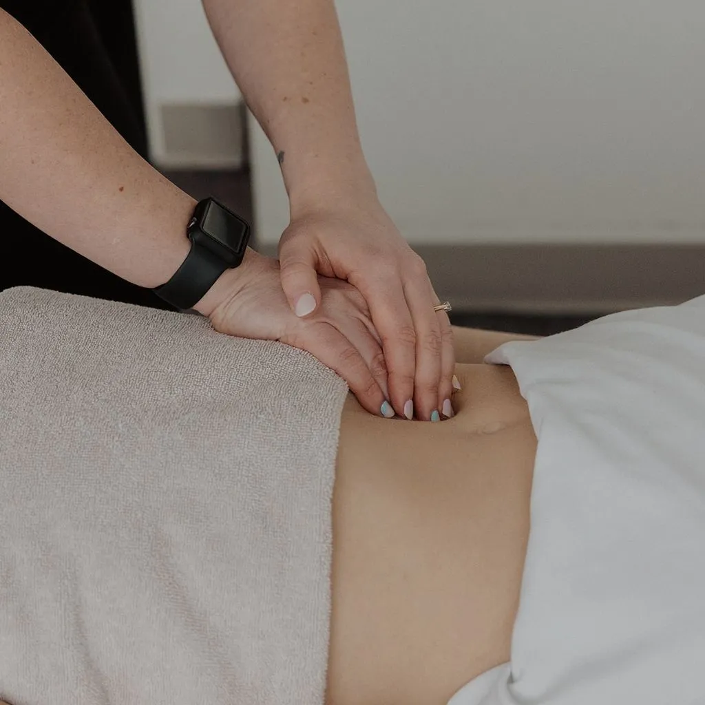 RMT using reinforced finger technique in prenatal massage session Kelowna