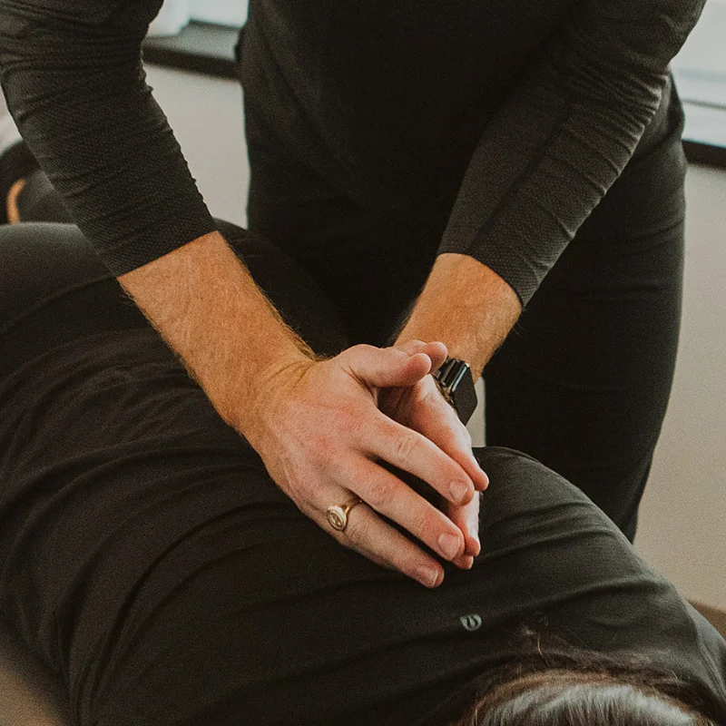  Chiropractor applying spinal treatment for workplace injury rehabilitation in Kelowna