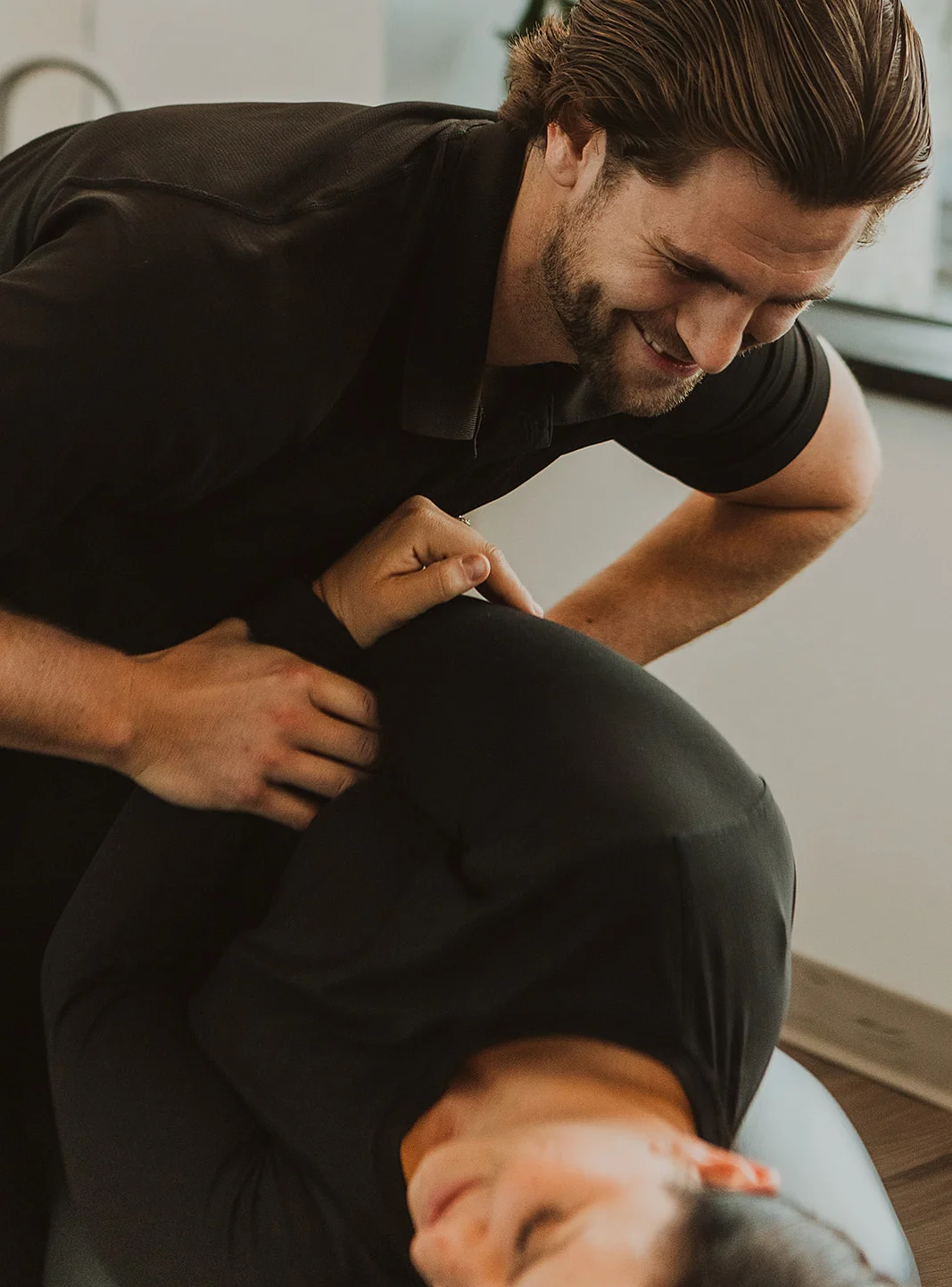 Chiropractor performing spinal adjustment for ICBC injury rehabilitation in Kelowna